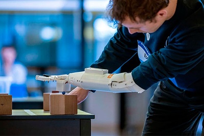 Student Kyle Briggs, the Arm2u team carrier, using the prosthesis in one of the tests at the Cybathlon Challenge in Switzerland in May