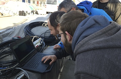 The researchers monitoring the operational parameters of the robot on the seabed.